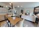 Bright open-concept living space with modern decor, dining area, and seamless flow at 1105 Freestone Rd, Durham, NC 27703