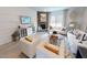 Comfortable living room featuring a stone fireplace and cozy seating arrangement at 1105 Freestone Rd, Durham, NC 27703