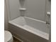 Bathroom with a clean white bathtub and a toilet at 1117 Mountain Crown St, Durham, NC 27704