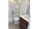 Clean bathroom featuring a glass-door shower, toilet, and vanity at 1117 Mountain Crown St, Durham, NC 27704