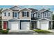 Charming townhome exteriors with attached garages and inviting curb appeal, nestled in a vibrant community at 1117 Mountain Crown St, Durham, NC 27704