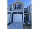 Charming townhome featuring two-car garage and contemporary two-tone exterior at 1117 Mountain Crown St, Durham, NC 27704