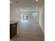 Sunlit living room with sliding door access to the backyard at 1117 Mountain Crown St, Durham, NC 27704