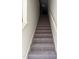 Carpeted staircase with handrail, leading to the upper level at 1117 Mountain Crown St, Durham, NC 27704