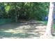 Spacious backyard with mature trees, perfect for outdoor activities at 1210 Shaw St, Burlington, NC 27217