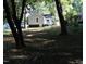 Private backyard with mature shade trees providing a serene escape at 1210 Shaw St, Burlington, NC 27217