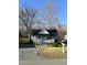 Lovely single story home featuring a cozy front porch with white railings and a walkway leading to the blue front door at 1210 Shaw St, Burlington, NC 27217