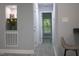 Hallway featuring a built-in display shelf and leading to other rooms with natural light at 1210 Shaw St, Burlington, NC 27217