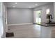 The kitchen is open to the living area, with hardwood floors throughout the space and a sliding door at 1210 Shaw St, Burlington, NC 27217