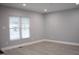 Bright living room featuring hardwood floors, recessed lighting, and a large window at 1210 Shaw St, Burlington, NC 27217