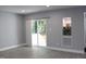 Bright living room featuring hardwood floors, recessed lighting, and sliding glass doors to deck at 1210 Shaw St, Burlington, NC 27217