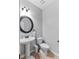 Powder room with pedestal sink and neutral decor at 125 Pinemere Ct, Cameron, NC 28326