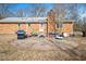 Home exterior featuring a patio with grill and a brick exterior, perfect for entertaining at 132 Cheryl Ave, Durham, NC 27712