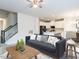 Open-concept living room leading to the kitchen with modern white cabinets at 1384 Channing Park Cir, Cary, NC 27519