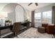 Bright home office featuring a modern desk, stylish decor, and cozy seating area with natural light at 1401 Hollyview Ave, Durham, NC 27703