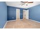 Spacious bedroom showcasing blue walls, carpet, ceiling fan and access to closet and bathroom at 172 Great Gln, Rocky Mount, NC 27804
