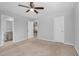 Carpeted bedroom with ceiling fan, an en suite bathroom, and closet access at 172 Great Gln, Rocky Mount, NC 27804