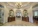 Grand foyer featuring decorative tile flooring, elegant mirrors, and a view into the living room at 172 Great Gln, Rocky Mount, NC 27804
