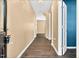 Inviting hallway with wood floors, neutral paint, and white trim leading to various rooms at 172 Great Gln, Rocky Mount, NC 27804