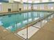 Indoor pool area with a ramp for accessibility and large windows for natural lighting at 172 Great Gln, Rocky Mount, NC 27804