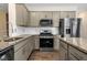 Stylish kitchen boasting granite countertops, stainless steel appliances, and ample cabinet space at 172 Great Gln, Rocky Mount, NC 27804