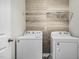 Functional laundry room with washer, dryer, and shelving at 172 Great Gln, Rocky Mount, NC 27804