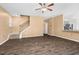 Spacious living room featuring wood floors, neutral walls, staircase, and seamless kitchen access at 172 Great Gln, Rocky Mount, NC 27804