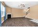 Inviting living room featuring wood floors, fireplace, natural light, and staircase at 172 Great Gln, Rocky Mount, NC 27804