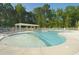 Resort-style pool with clear blue water, sun loungers, and a covered pergola for relaxation at 172 Great Gln, Rocky Mount, NC 27804