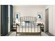 Bedroom with a metal bed frame, minimalist decor, and two side tables at 1759 Barrett Run Trl, Apex, NC 27502