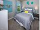Cozy bedroom featuring soft gray hues, a comfortable bed, and stylish decor at 1780 Pie Filling Dr, Haw River, NC 27258