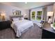 Serene bedroom with soft lighting and ample natural light from backyard view at 1780 Pie Filling Dr, Haw River, NC 27258