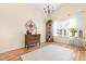 Bright and airy living room featuring vaulted ceilings, wood floors, and natural light at 1906 Holly Knoll Ln, Fuquay Varina, NC 27526