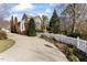 Charming home with a well-manicured lawn, driveway and white picket fence at 20010 Grier, Chapel Hill, NC 27517