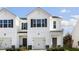 Charming townhome with a one-car garage and a classic white facade at 204 Starlight St, Sanford, NC 27330