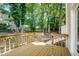 Wooden deck overlooks the trees in this home's backyard at 207 Wyatts Pond Ln, Cary, NC 27513