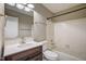 Bright bathroom features a vanity with mirror and updated fixtures at 207 Wyatts Pond Ln, Cary, NC 27513