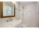 Updated bathroom features a sink, wood-trimmed mirror, toilet, and subway tiled shower at 207 Wyatts Pond Ln, Cary, NC 27513