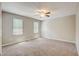 Bright bedroom with neutral walls and two windows offering natural light at 207 Wyatts Pond Ln, Cary, NC 27513