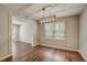 Sunny dining area with dark floors and a large window for natural light at 207 Wyatts Pond Ln, Cary, NC 27513