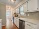 Well-lit kitchen showcasing modern appliances and a view to the next room at 207 Wyatts Pond Ln, Cary, NC 27513