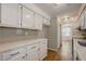 Modern kitchen with white cabinets and light countertops at 207 Wyatts Pond Ln, Cary, NC 27513