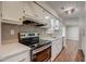 Beautiful kitchen featuring new stainless appliances, tiled backsplash, and stylish countertops at 207 Wyatts Pond Ln, Cary, NC 27513
