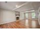 Spacious living room with brick fireplace and lots of natural light at 207 Wyatts Pond Ln, Cary, NC 27513