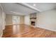 Basement living room with brick fireplace and access to the patio at 207 Wyatts Pond Ln, Cary, NC 27513