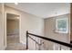 Staircase with lots of natural light from a window and views of other rooms at 207 Wyatts Pond Ln, Cary, NC 27513