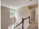 Staircase with chandelier and views of the foyer and other rooms at 207 Wyatts Pond Ln, Cary, NC 27513