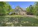 A beautiful home featuring a spacious backyard and a screened-in porch, perfect for enjoying the outdoors at 209 Democracy Pl, Apex, NC 27523