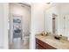 Bathroom with a wooden vanity and doorway view to a bedroom at 209 Democracy Pl, Apex, NC 27523