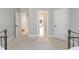 Spacious bedroom with an open hallway to a front room at 209 Democracy Pl, Apex, NC 27523